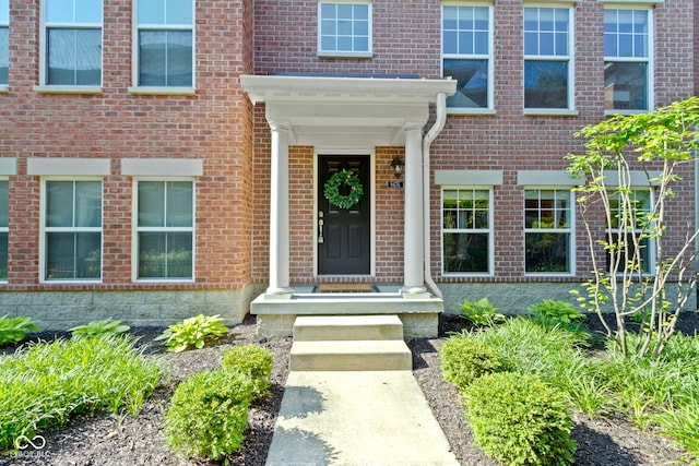 9476 Oakley Dr, Indianapolis, IN 46260 - view of exterior entry featuring brick siding