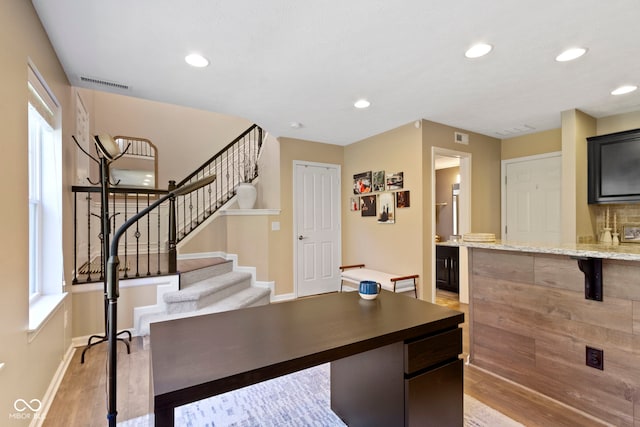 9476 Oakley Dr, Indianapolis, IN 46260 - office space featuring light wood-style flooring, plenty of natural light, and recessed lighting