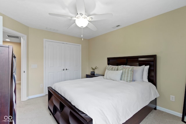 9476 Oakley Dr, Indianapolis, IN 46260 - bedroom with freestanding refrigerator, light colored carpet, a closet, and ceiling fan