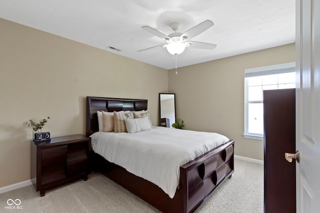9476 Oakley Dr, Indianapolis, IN 46260 - bedroom with light colored carpet and a ceiling fan