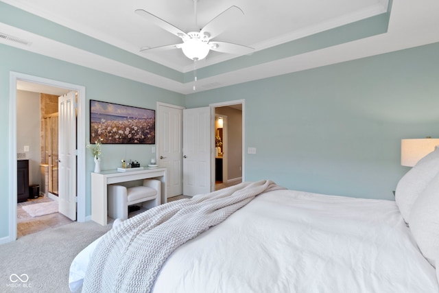 9476 Oakley Dr, Indianapolis, IN 46260 - bedroom with a raised ceiling, carpet flooring, ensuite bathroom, and a ceiling fan
