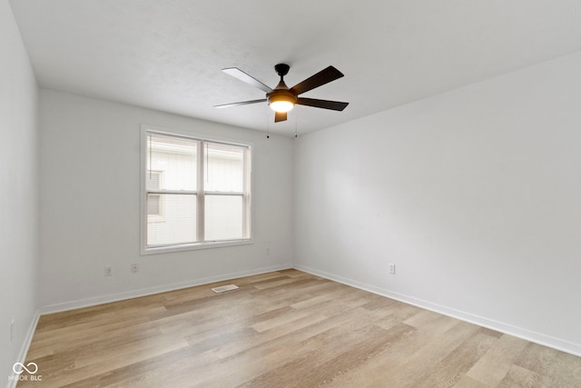 4129 Cornelius Ave, Indianapolis, IN 46208 - empty room with light wood finished floors and a ceiling fan