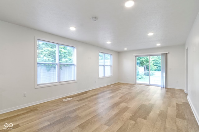 4129 Cornelius Ave, Indianapolis, IN 46208 - spare room with light wood-type flooring, recessed lighting, and a smoke detector
