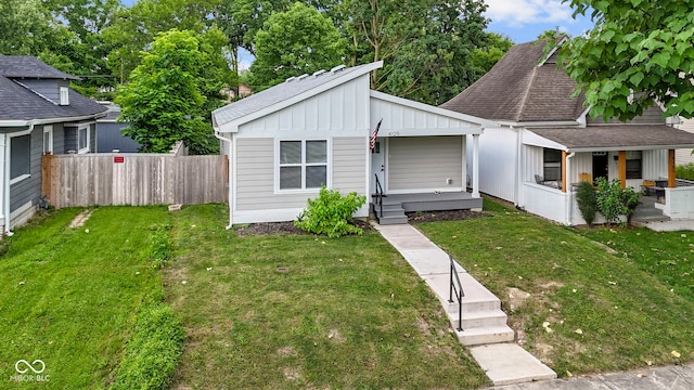 4129 Cornelius Ave, Indianapolis, IN 46208 - bungalow-style house with a porch, board and batten siding, and roof with shingles