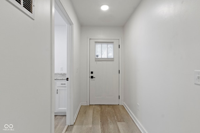 4129 Cornelius Ave, Indianapolis, IN 46208 - doorway with light wood-style flooring and baseboards