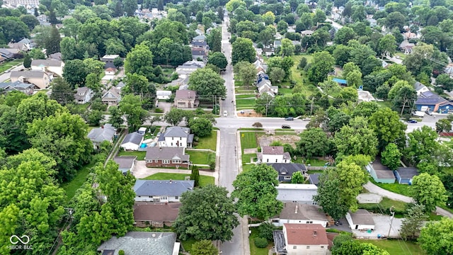4129 Cornelius Ave, Indianapolis, IN 46208 - aerial overview of property's location with nearby suburban area and a tree filled landscape