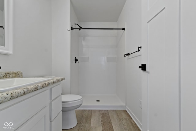 4129 Cornelius Ave, Indianapolis, IN 46208 - bathroom featuring wood finished floors, vanity, and a shower
