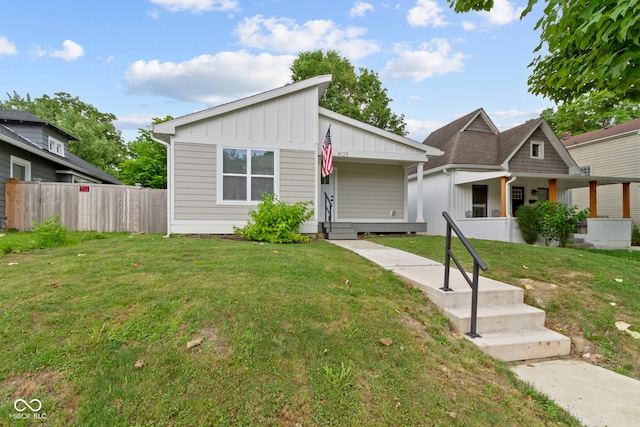 4129 Cornelius Ave, Indianapolis, IN 46208 - view of front facade with board and batten siding and a porch