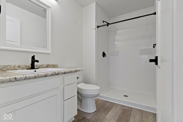 4129 Cornelius Ave, Indianapolis, IN 46208 - bathroom featuring wood finished floors, vanity, and a shower