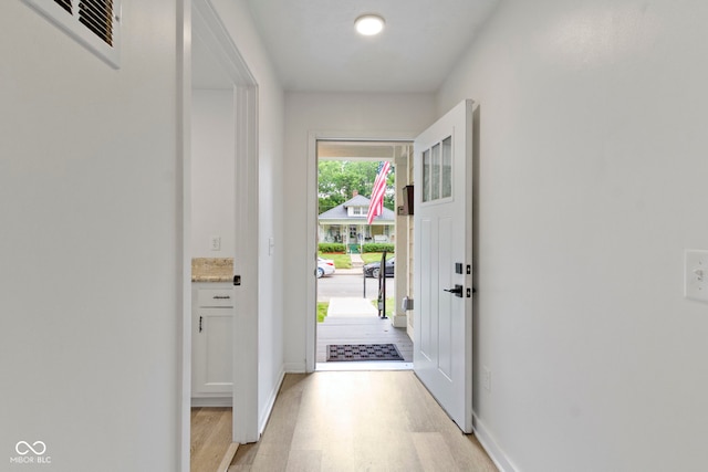 4129 Cornelius Ave, Indianapolis, IN 46208 - doorway featuring light wood-type flooring and baseboards