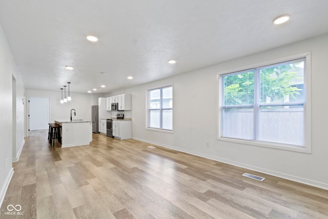 4129 Cornelius Ave, Indianapolis, IN 46208 - unfurnished living room featuring light wood-style floors and recessed lighting