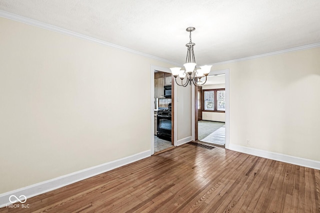 3760 Brill Rd, Indianapolis, IN 46227 - unfurnished dining area featuring a chandelier, hardwood / wood-style floors, and ornamental molding