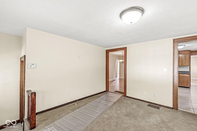 3760 Brill Rd, Indianapolis, IN 46227 - unfurnished room with a textured ceiling and light carpet