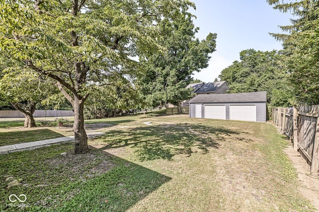 3760 Brill Rd, Indianapolis, IN 46227 - fenced backyard featuring a garage and an outbuilding