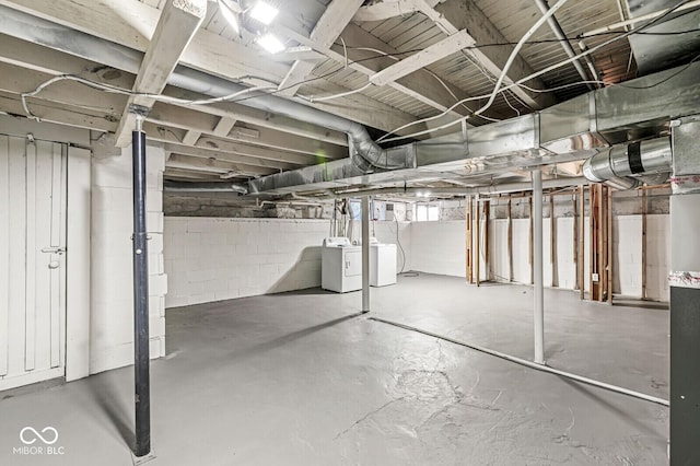 3760 Brill Rd, Indianapolis, IN 46227 - basement featuring washing machine and dryer and concrete block wall