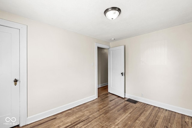 3760 Brill Rd, Indianapolis, IN 46227 - unfurnished bedroom featuring baseboards and wood finished floors