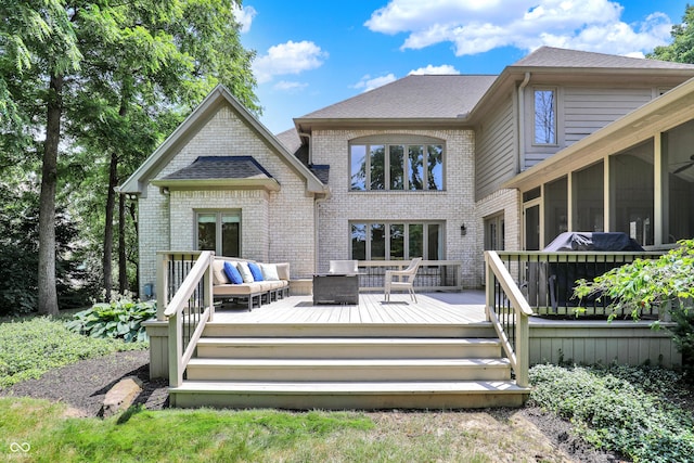 9690 Irishmans Run Ln, Zionsville, IN 46077 - back of house with an outdoor living space, brick siding, a deck, roof with shingles, and a sunroom