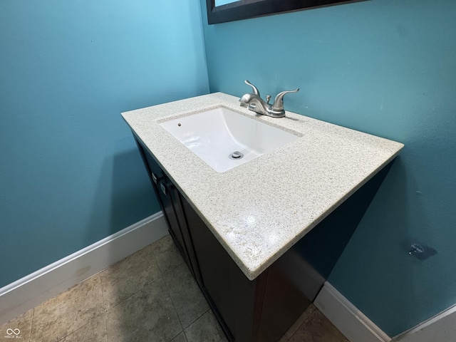 817 Pearl St, Covington, IN 47932 - bathroom with vanity and baseboards