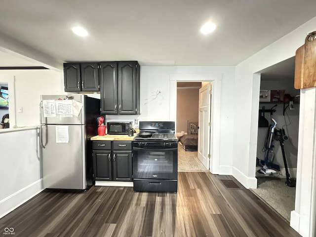 817 Pearl St, Covington, IN 47932 - kitchen with black appliances, dark wood-style floors, and light countertops