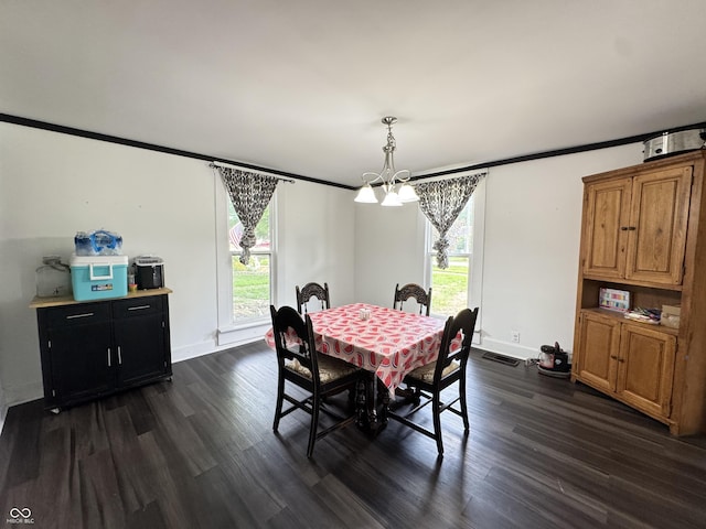 817 Pearl St, Covington, IN 47932 - dining room with a chandelier, plenty of natural light, dark wood finished floors, and ornamental molding