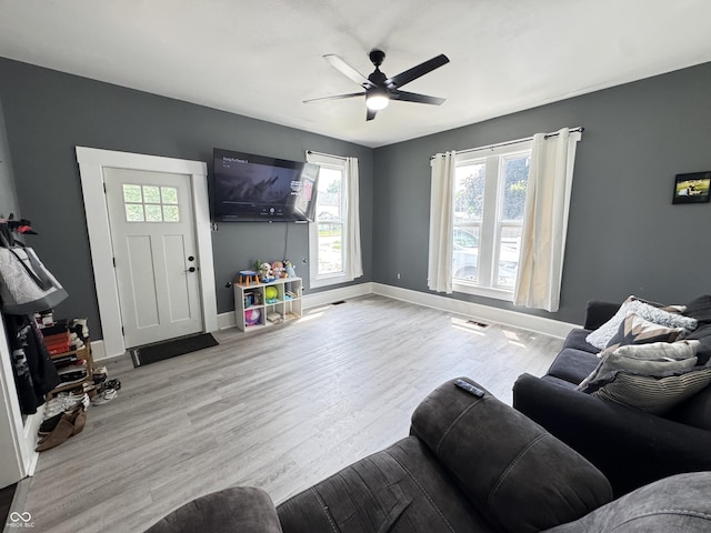 817 Pearl St, Covington, IN 47932 - living room featuring healthy amount of natural light, wood finished floors, and a ceiling fan