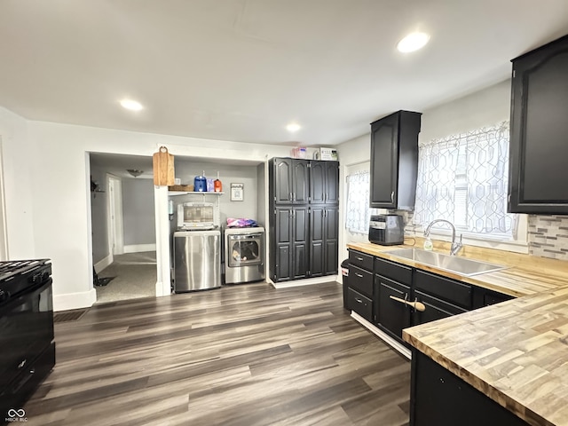 817 Pearl St, Covington, IN 47932 - kitchen with wood counters, range, dark wood-type flooring, washing machine and dryer, and recessed lighting