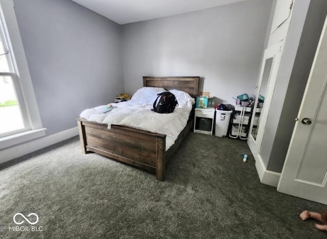 817 Pearl St, Covington, IN 47932 - bedroom featuring dark colored carpet and baseboards