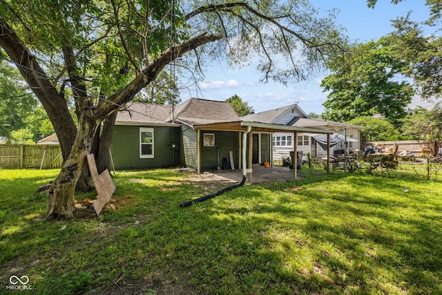 761 N Holmes Ave, Indianapolis, IN 46222 - back of property featuring a fenced backyard and a patio