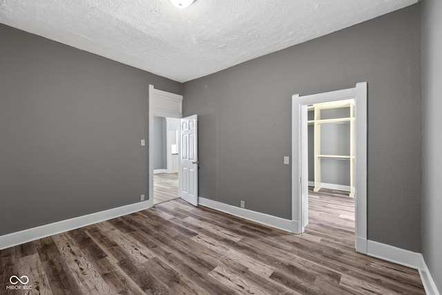 761 N Holmes Ave, Indianapolis, IN 46222 - spare room with wood finished floors and a textured ceiling