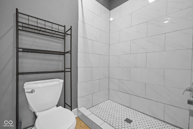 761 N Holmes Ave, Indianapolis, IN 46222 - bathroom featuring a stall shower and a textured wall