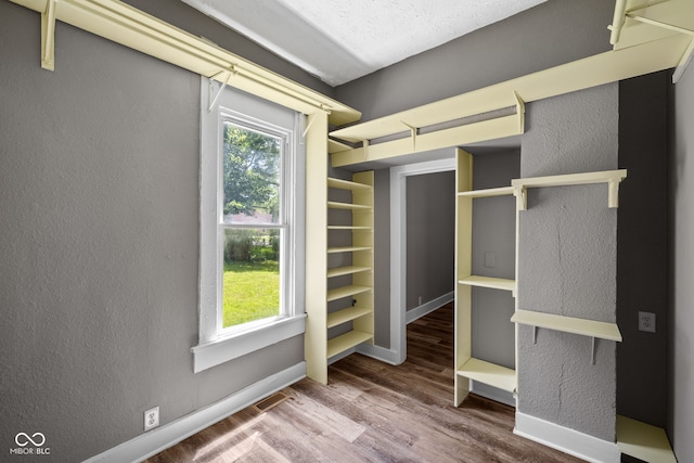 761 N Holmes Ave, Indianapolis, IN 46222 - walk in closet featuring wood finished floors