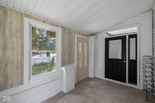 761 N Holmes Ave, Indianapolis, IN 46222 - tiled foyer entrance featuring wood walls and vaulted ceiling