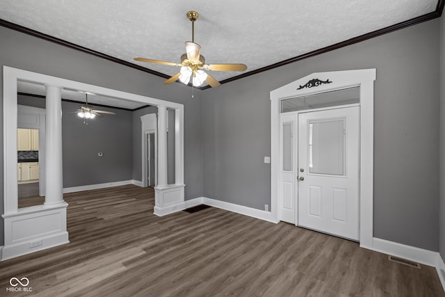 761 N Holmes Ave, Indianapolis, IN 46222 - unfurnished room featuring decorative columns, ornamental molding, ceiling fan, a textured ceiling, and wood finished floors