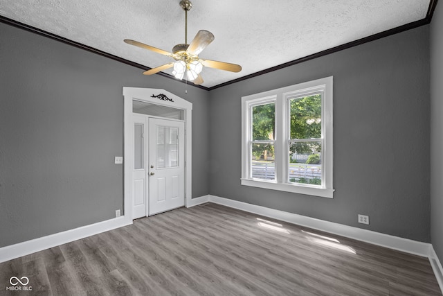 761 N Holmes Ave, Indianapolis, IN 46222 - spare room with ornamental molding, a textured ceiling, wood finished floors, and ceiling fan