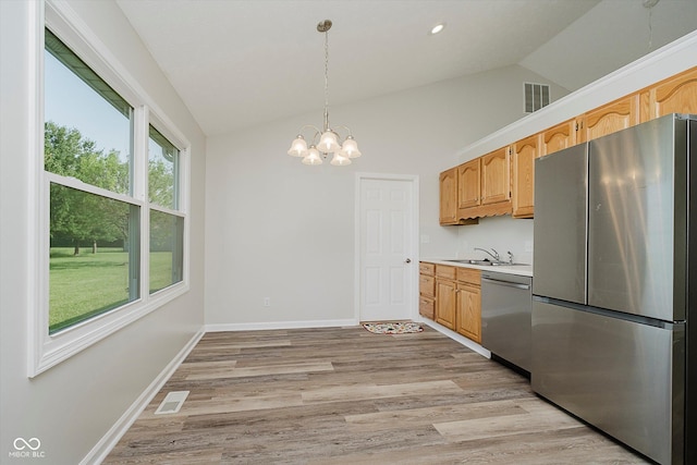 4330 S 100 E, Lebanon, IN 46052 - kitchen featuring appliances with stainless steel finishes, light wood-type flooring, light countertops, a chandelier, and decorative light fixtures