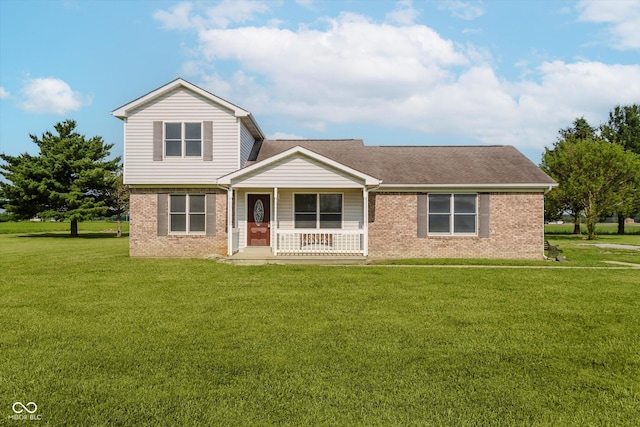 4330 S 100 E, Lebanon, IN 46052 - view of front of home featuring brick siding, covered porch, a front lawn, and roof with shingles