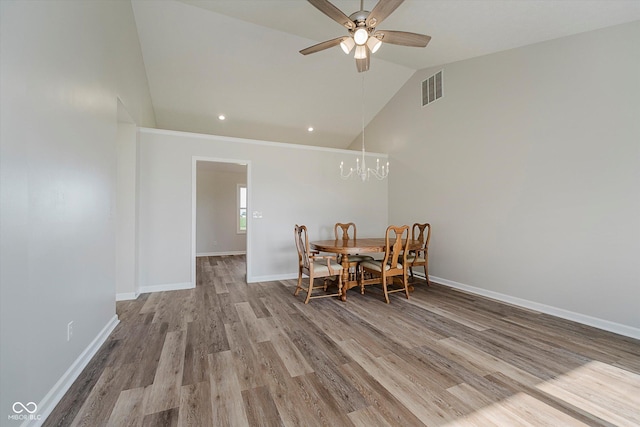 4330 S 100 E, Lebanon, IN 46052 - dining area with wood finished floors, a ceiling fan, a chandelier, high vaulted ceiling, and recessed lighting
