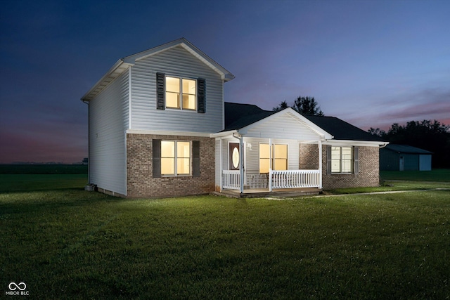 4330 S 100 E, Lebanon, IN 46052 - view of front of home featuring a porch, brick siding, and a lawn