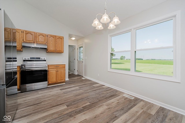 4330 S 100 E, Lebanon, IN 46052 - kitchen featuring electric stove, under cabinet range hood, light wood-type flooring, light countertops, and vaulted ceiling