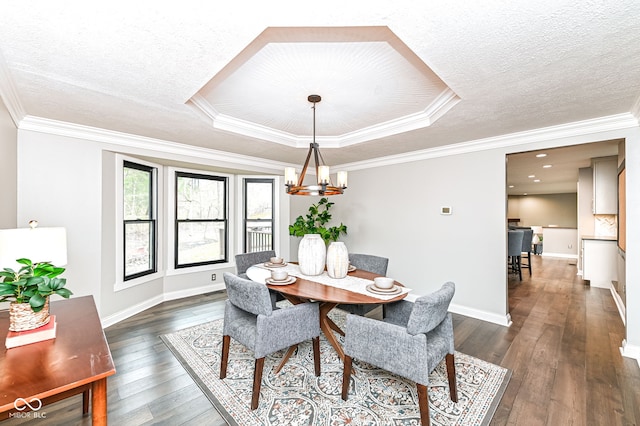 5826 Winding Way Ln, Indianapolis, IN 46220 - dining room featuring a chandelier, dark wood-type flooring, a textured ceiling, and ornamental molding
