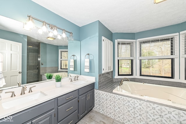 5826 Winding Way Ln, Indianapolis, IN 46220 - full bathroom with a whirlpool tub, double vanity, walk in shower, and a textured ceiling