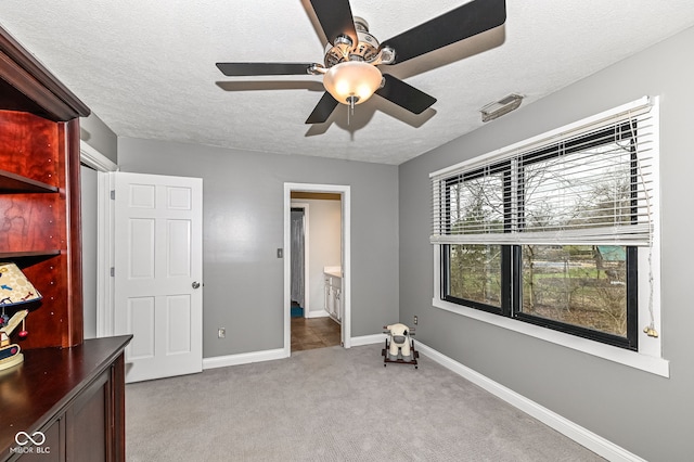 5826 Winding Way Ln, Indianapolis, IN 46220 - unfurnished bedroom featuring a textured ceiling, light carpet, a ceiling fan, and ensuite bathroom
