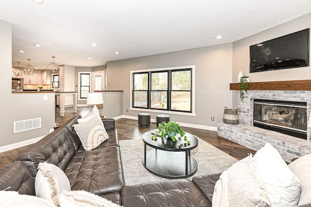 5826 Winding Way Ln, Indianapolis, IN 46220 - living area with recessed lighting, a brick fireplace, and wood finished floors