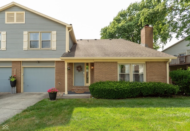 7612 Farm View Cir E, Indianapolis, IN 46256 - view of front of house with brick siding, concrete driveway, and a front lawn