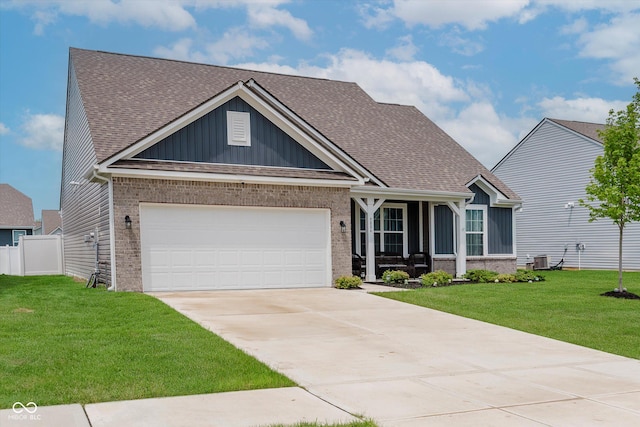 9806 Olympic Blvd, Pendleton, IN 46064 - craftsman-style home featuring brick siding, driveway, a front lawn, and a garage