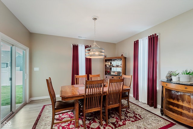 9806 Olympic Blvd, Pendleton, IN 46064 - dining room with light wood finished floors and a chandelier