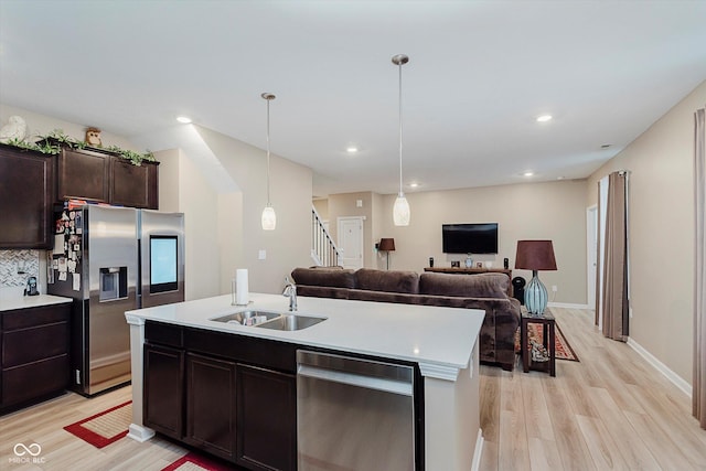 9806 Olympic Blvd, Pendleton, IN 46064 - kitchen featuring appliances with stainless steel finishes, light wood-type flooring, open floor plan, light countertops, and recessed lighting