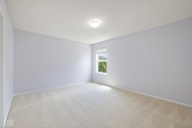 12997 Bartlett Dr, Fishers, IN 46037 - empty room with light colored carpet and baseboards