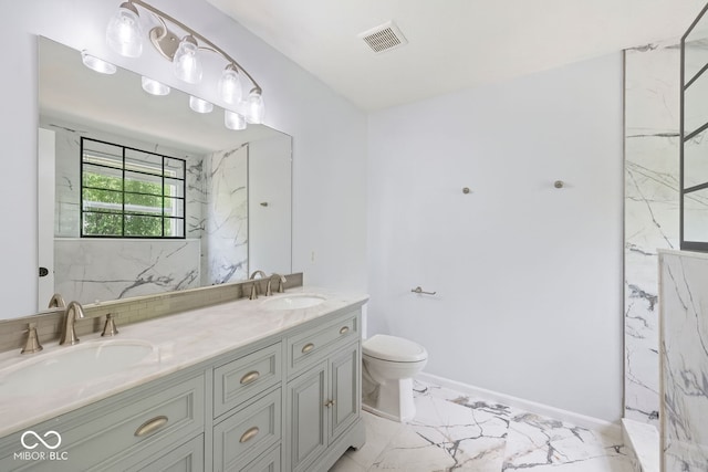 12997 Bartlett Dr, Fishers, IN 46037 - bathroom with marble look tile flooring, double vanity, and a marble finish shower