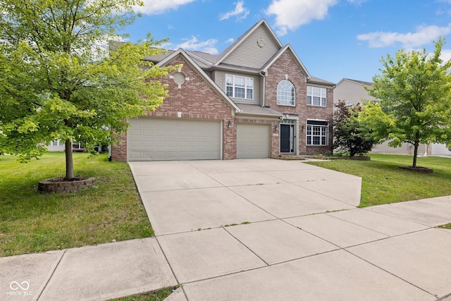 12997 Bartlett Dr, Fishers, IN 46037 - view of front facade featuring brick siding, a front yard, driveway, and a garage